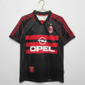 Maillot rétro de football AC Milan 1998-1999, maillot third de la marque Le 12-ème Maillot, vue de face avec logo et détails.