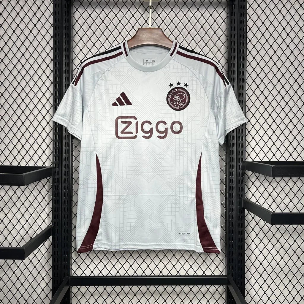 Maillot Ajax Amsterdam 2024-2025 third de Le 12, maillot de football orange avec logo officiel et design moderne.