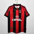 Maillot domicile rétro AC Milan 1998-1999, marque Le 12-ème Maillot, maillot de football avec logo et couleurs traditionnelles.