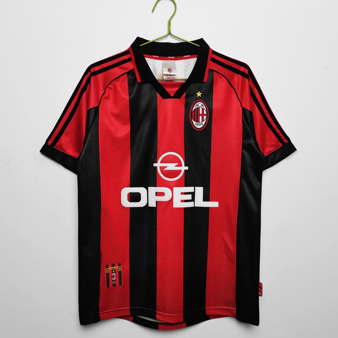 Maillot domicile rétro AC Milan 1998-1999, marque Le 12-ème Maillot, maillot de football avec logo et couleurs traditionnelles.