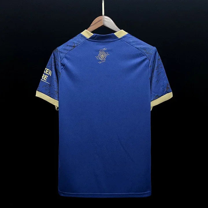 Maillot Manchester City 2023/24 Le 12 -ème Maillot, devant avec logo et design officiel de l'équipe de football.