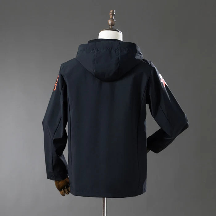 Veste coupe-vent réversible Le 12 ème Maillot, design Brésil noir, tissu léger et pratique pour le sport ou la pluie