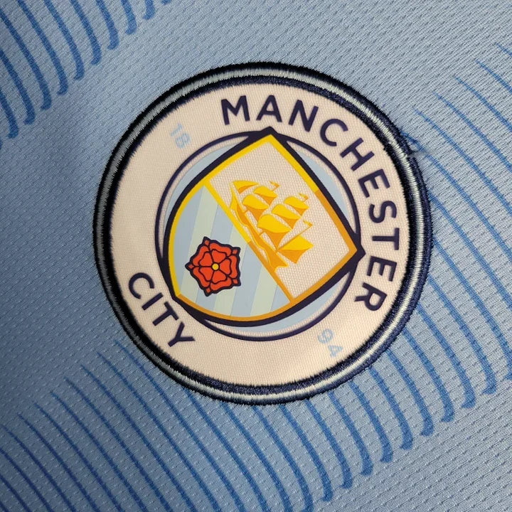 Maillot domicile Manchester City 2023-2024 Le 12 -ème Maillot, maillot de football avec logo et design officiel.