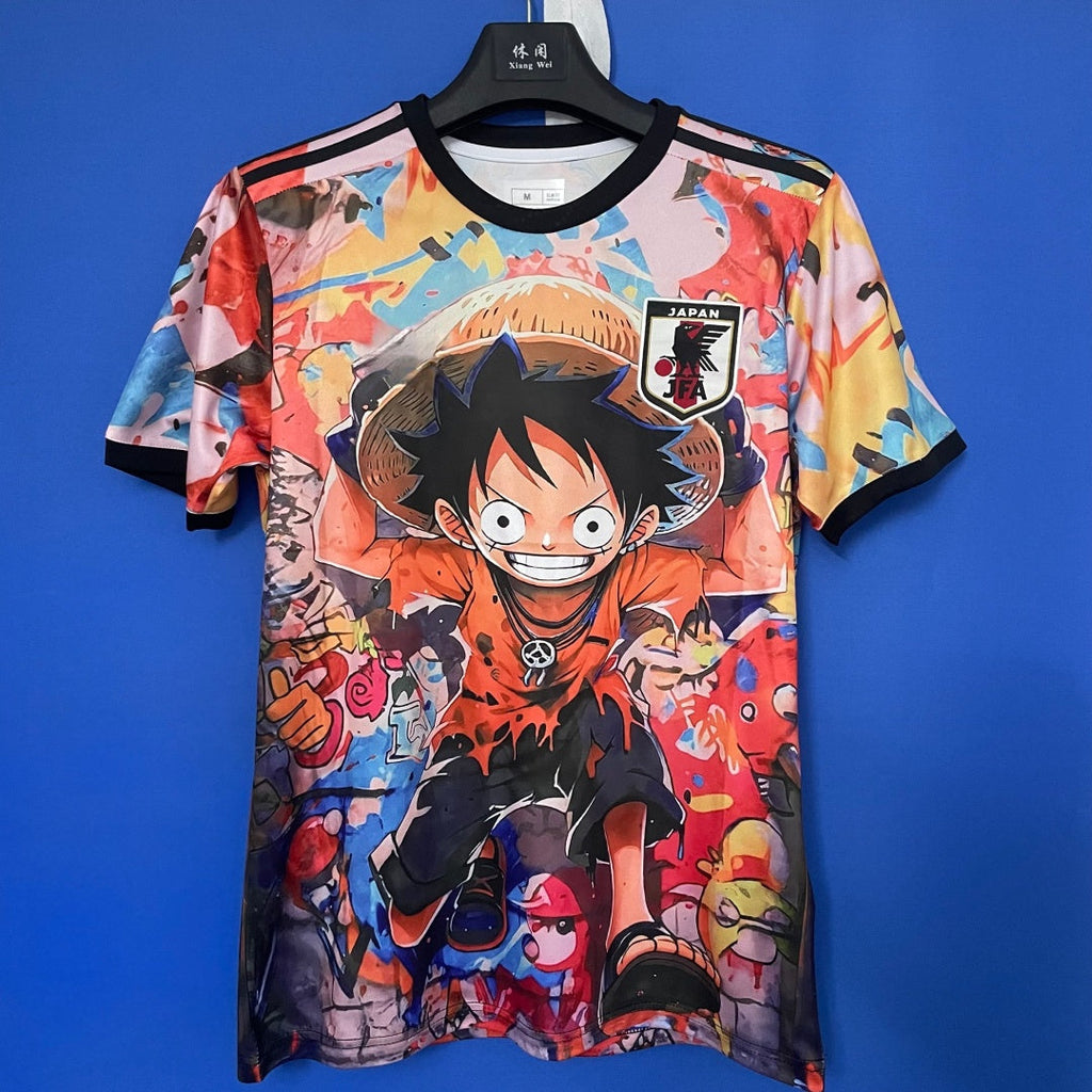 Maillot japonais 25/26 anime spécial F, marque Le 12 -ème Maillot, avec design coloré et motifs inspirés de l'anime japonais.