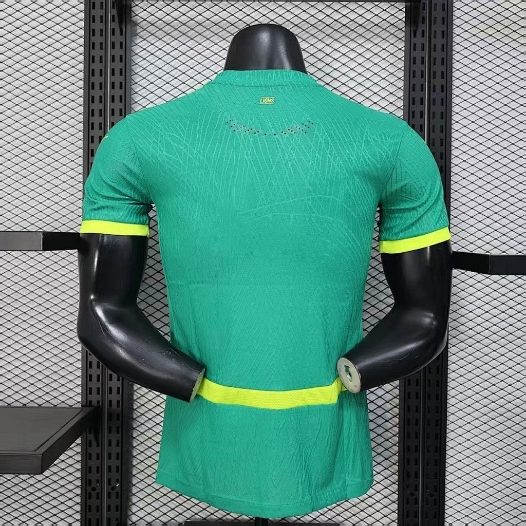 Maillot Sénégal 2026 Le 12 -ème Maillot, maillot de football jaune avec logo et motifs verts, vue frontale.