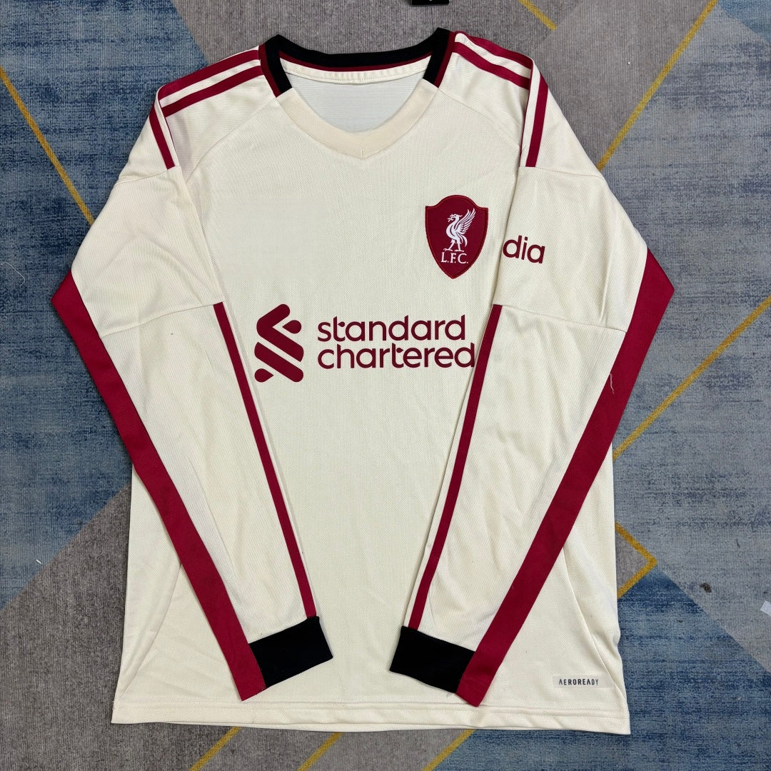 Maillot Liverpool extérieur à manches longues, modèle Le 12 -ème Maillot, en tissu principal bleu avec logo de l'équipe.