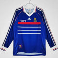 Maillot rétro de l'équipe de France 1998 à manches longues, marque Le 12 -ème Maillot, visible avec détails du design.