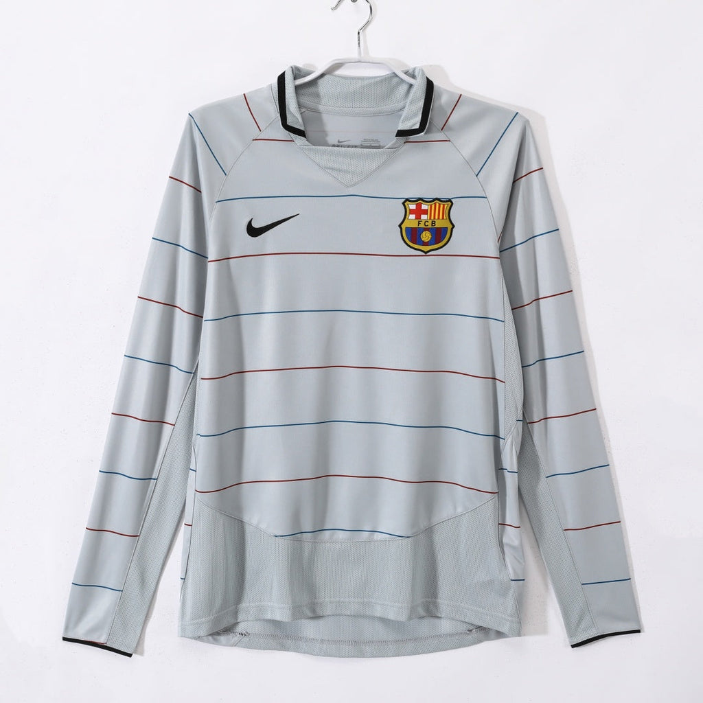 Maillot extérieur rétro de Barcelone 2003-2004 à manches longues, marque Le 12, avec logo du club visible sur le devant.