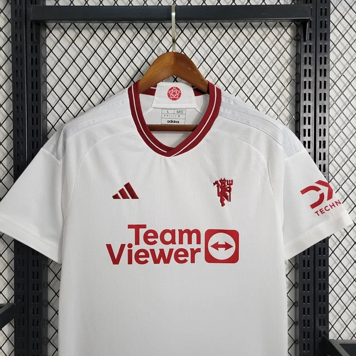 Maillot extérieur Manchester United 2023-2024 Le 12-ème Maillot, maillot de football avec logo et détails de l'équipe.