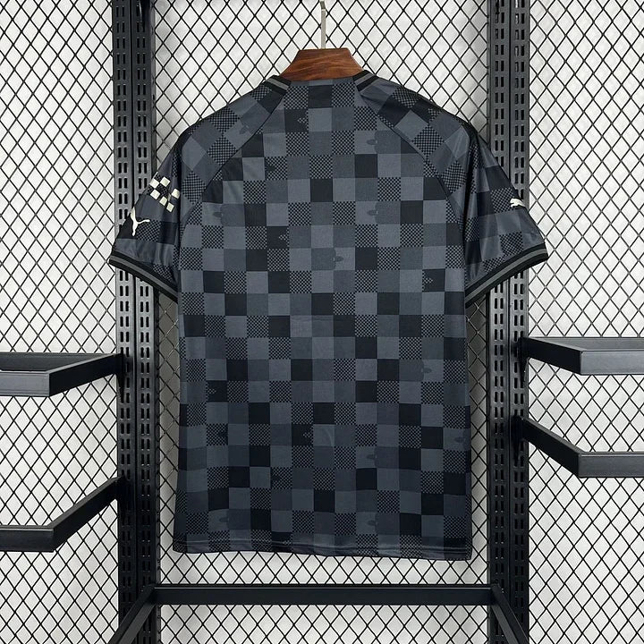 Maillot City foot noir de la marque Le 12 -ème Maillot, design élégant pour 2024-2025, visible sur l'image.