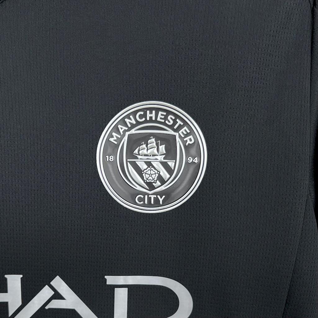 Maillot Manchester City 2025-26 Le 12 -ème Maillot, maillot de football avec logo et design moderne visible sur l'image.