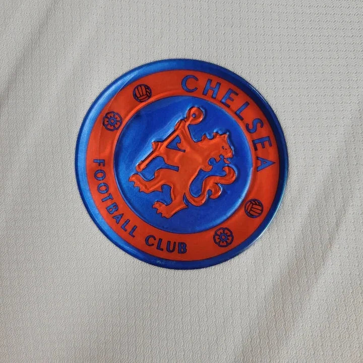 Maillot extérieur Chelsea 2024/25 Le 12 -ème Maillot, design bleu avec logo du club, vue front présentant le maillot de football