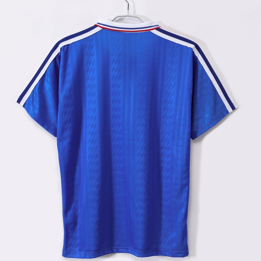 Maillot rétro domicile de l'équipe de France 1994, marque Le 12 -ème Maillot, coloris bleu avec logo officiel.