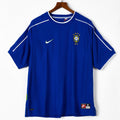 Maillot extérieur rétro du Brésil 1998, marque Le 12 -ème Maillot, avec design vintage et logo officiel visible dans l'image.