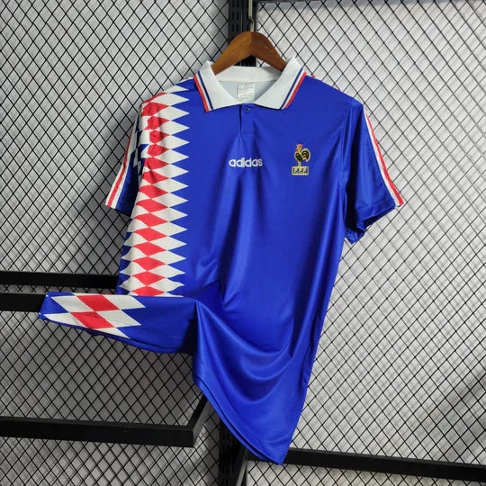 Maillot rétro de l'équipe de France 1994 par Le 12, vue de face avec logo et détails du design vintage.