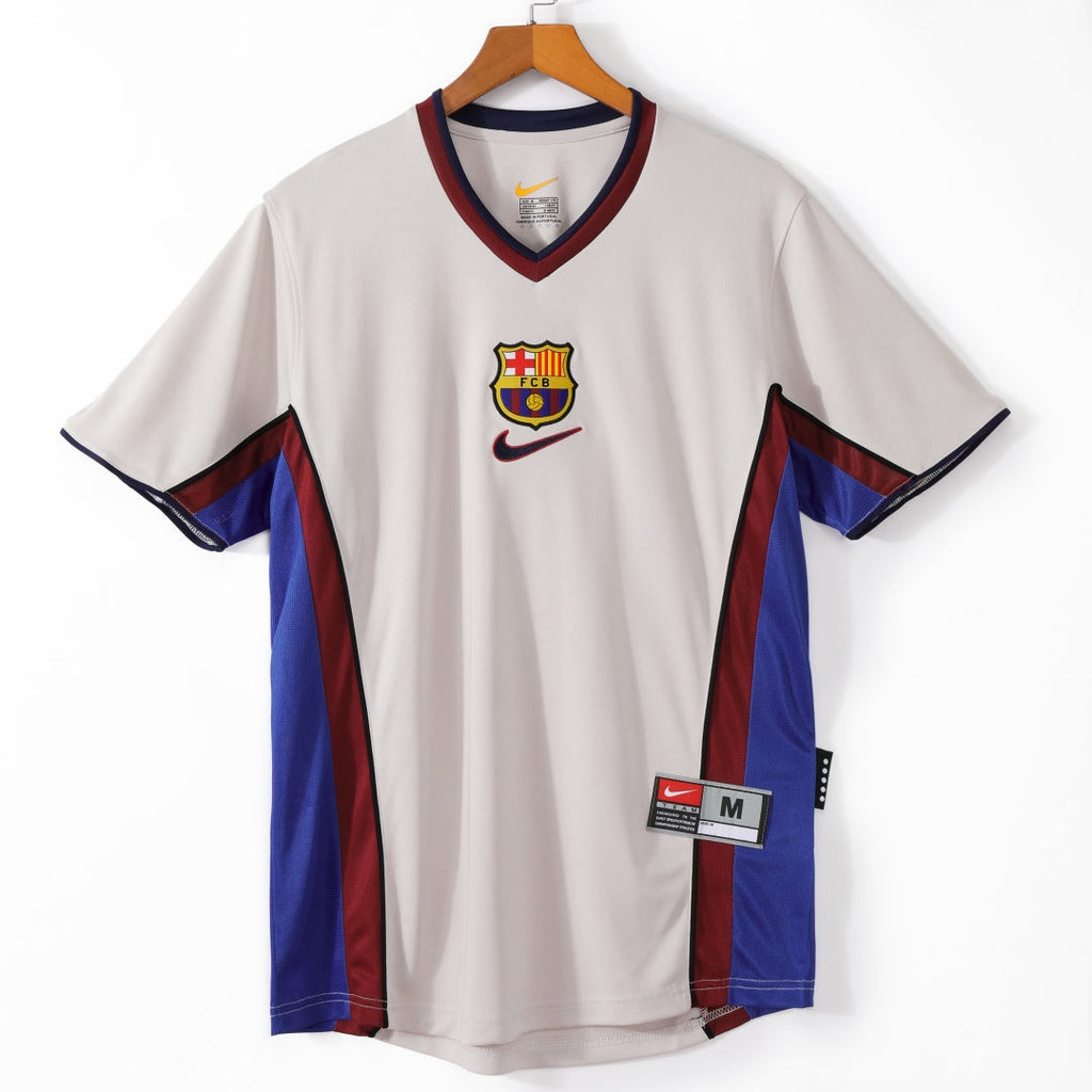Maillot extérieur rétro du FC Barcelone 1998-1999, marque Le 12, vue de face, avec les couleurs traditionnelles blaugrana.