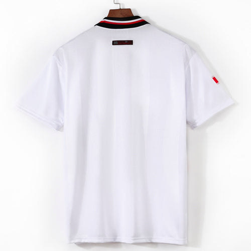 Maillot extérieur rétro Manchester United 1998-1999, marque Le 12ème Maillot, vue de face avec logo et détails de l'équipe.