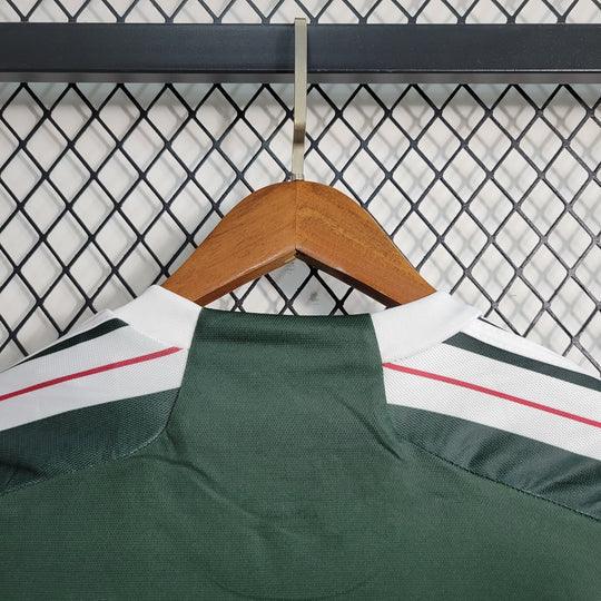 Maillot extérieur Manchester United 2023 2024 manches longues de la marque Le 12 -ème Maillot, vue de face avec logo et design.