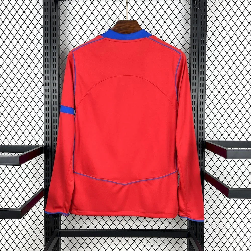 Maillot manches longues PSG rouge Le 12-ème Maillot, jersey de football avec logo du Paris Saint-Germain visible.