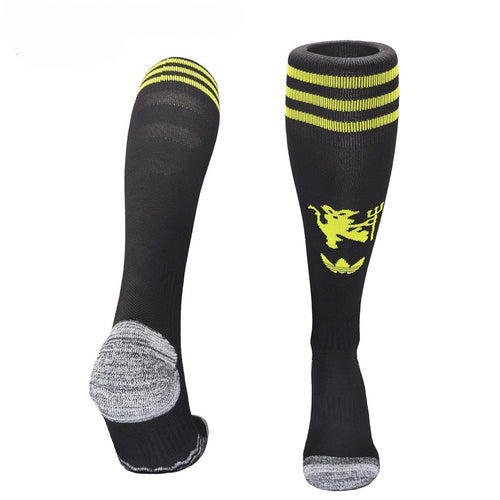 Chaussettes Manchester United Third de la marque Le 12-ème Maillot, détails en rouge et blanc, logo de Manchester United visible.