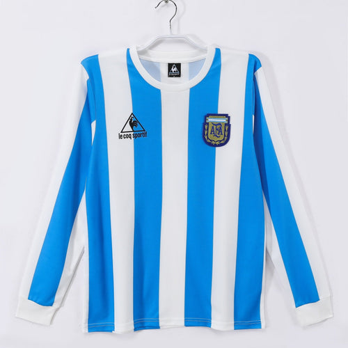 Maillot rétro domicile Argentine 1986 à manches longues, marque Le 12 -ème Maillot, avec le logo de l'équipe nationale.