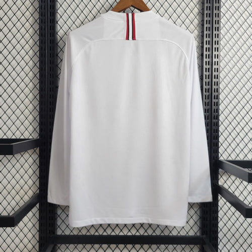Maillot extérieur rétro du PSG 2018-2019 à manches longues, signé Le 12 -ème Maillot, vue de face sur fond neutre.