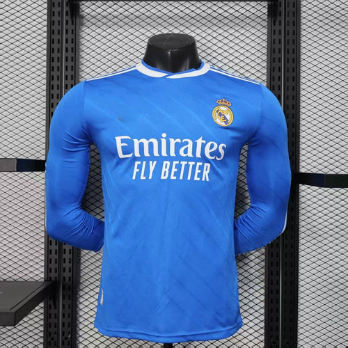 Maillot Real Madrid Third à manches longues, marque Le 12 -ème Maillot, pour joueur, en tissu bleu avec logo et détails du club.