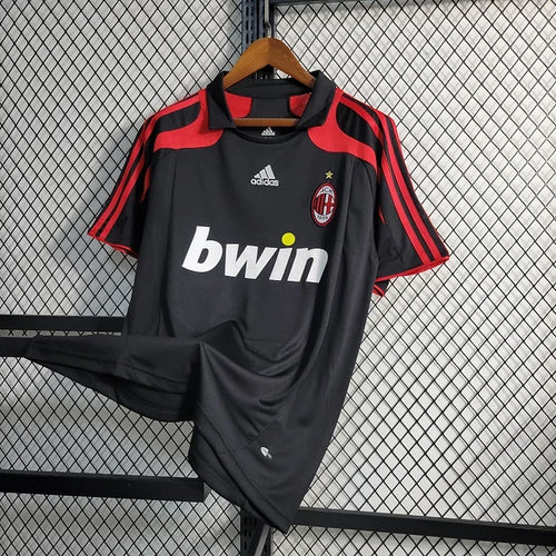 Maillot rétro de l'AC Milan 2007-2008 de la marque Le 12 -ème Maillot, vue de face avec logo et détails du design.