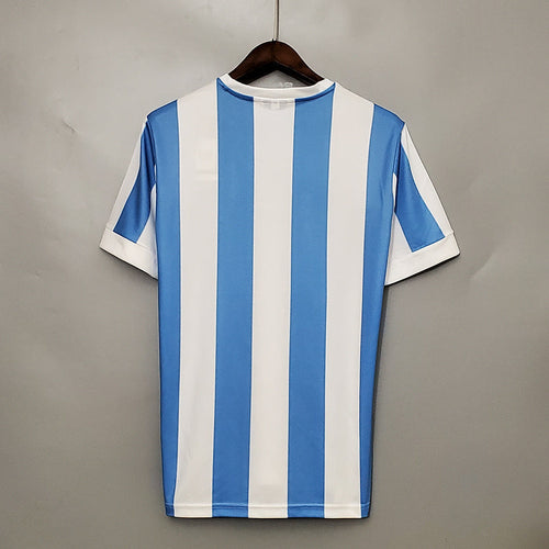 Maillot Argentine de la Coupe du Monde 1978 Le 12 -ème Maillot, rétro avec logo et détails vintage visible sur l'image.