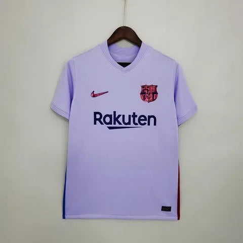 Maillot extérieur FC Barcelone 21/22 Le 12, maillot de football bleu avec logo du club et détails en rouge et blanc.