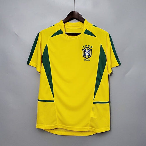 Maillot domicile rétro du Brésil 2002 de la marque Le 12, style vintage avec couleurs traditionnelles, vue de face.