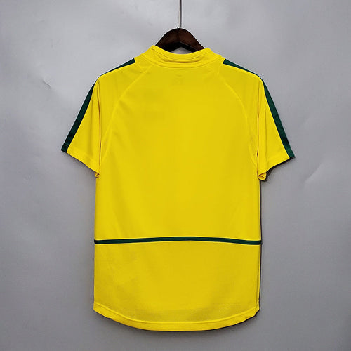 Maillot domicile rétro 2002 du Brésil, modèle Le 12 -ème Maillot, vue de face avec logo et détails traditionnels.