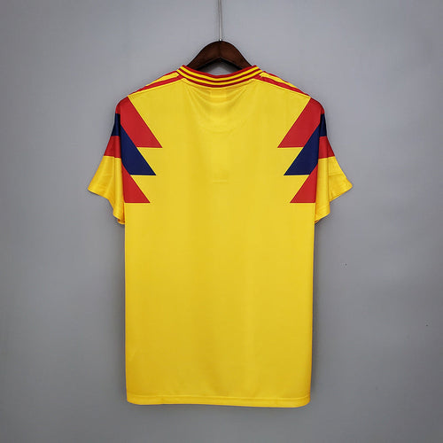 Maillot domicile rétro de la Colombie 1990, marque Le 12 -ème Maillot, vue de face avec les couleurs traditionnelles colombiennes