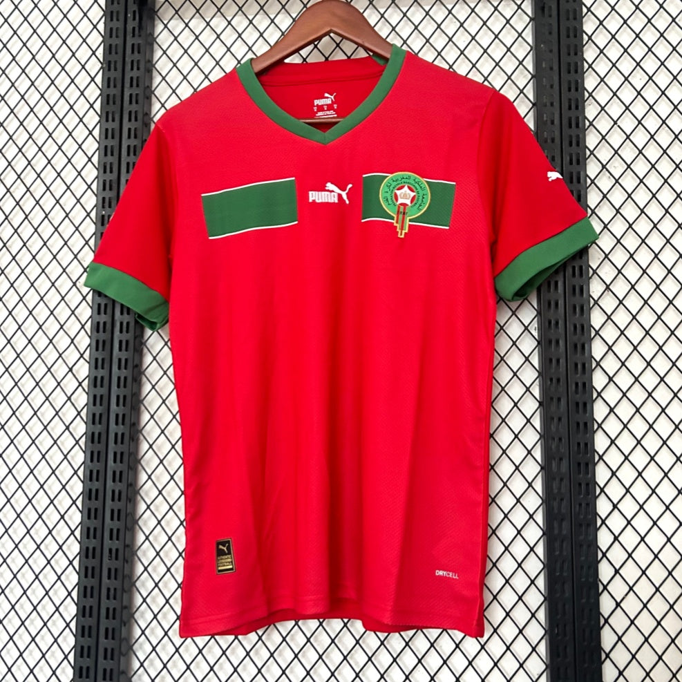 Maillot domicile 2022 du Maroc, marque Le 12 -ème Maillot, en bleu avec logo national et détails de l'équipe.