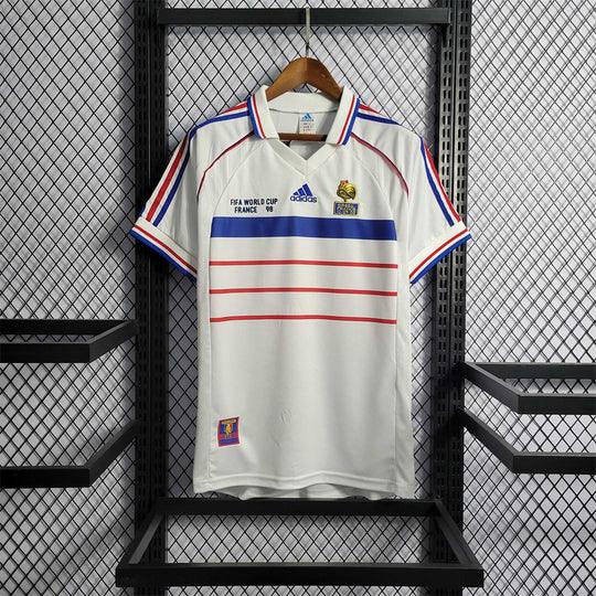 Maillot rétro de l'équipe de France 1998, modèle Le 12 -ème Maillot, avec design vintage et logo national.