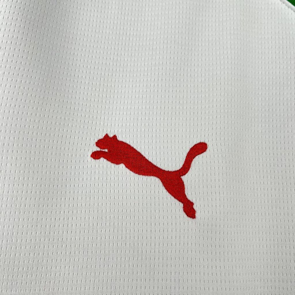 Maillot extérieur du Maroc CAN 2025-26, modèle Le 12 -ème Maillot, en tissu bleu avec logo national visible.