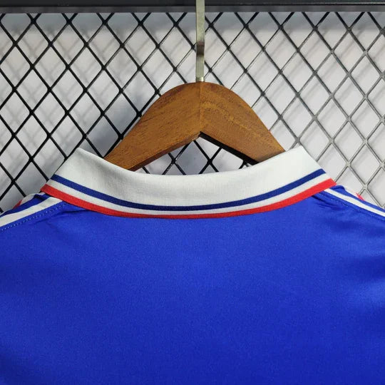Maillot rétro de l'équipe de France 1994 de la marque Le 12 -ème Maillot, vue de face sur fond blanc.